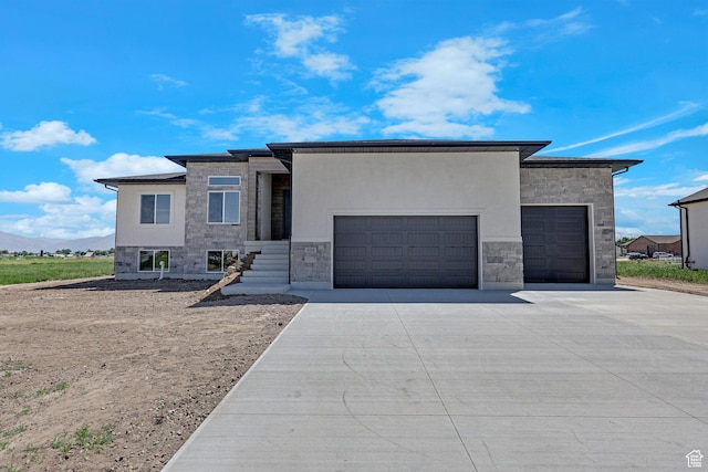 4594 S 6300 W, Hooper, UT 84315 - view of front facade with stone siding, driveway, an attached garage, and stucco siding