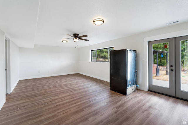 4077 N Devonshire Cir, Provo, UT 84604 - empty room featuring french doors, ceiling fan, baseboards, and wood finished floors