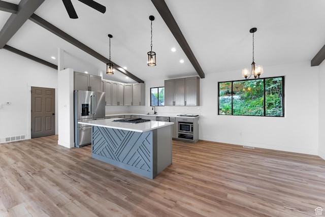 4077 N Devonshire Cir, Provo, UT 84604 - kitchen featuring high end fridge, gray cabinets, gas cooktop, a center island, and light countertops