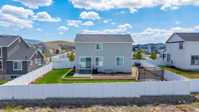 1815 E Thunder Gulch Rd, Eagle Mountain, UT 84005 - rear view of house featuring a residential view, stucco siding, entry steps, and a patio