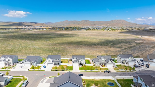 1815 E Thunder Gulch Rd, Eagle Mountain, UT 84005 - aerial perspective of suburban area with a mountainous background