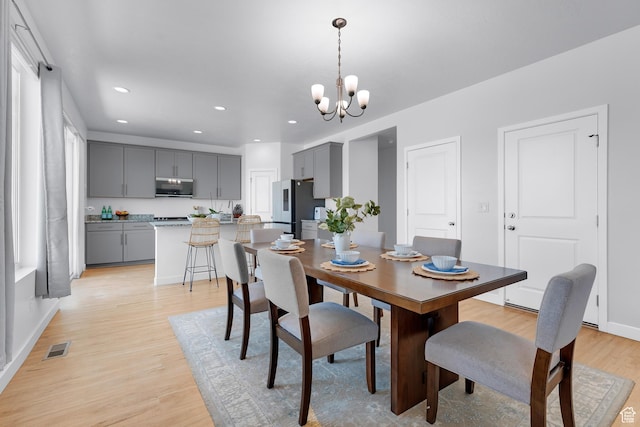 1815 E Thunder Gulch Rd, Eagle Mountain, UT 84005 - dining area featuring light wood-style flooring, a chandelier, recessed lighting, and baseboards