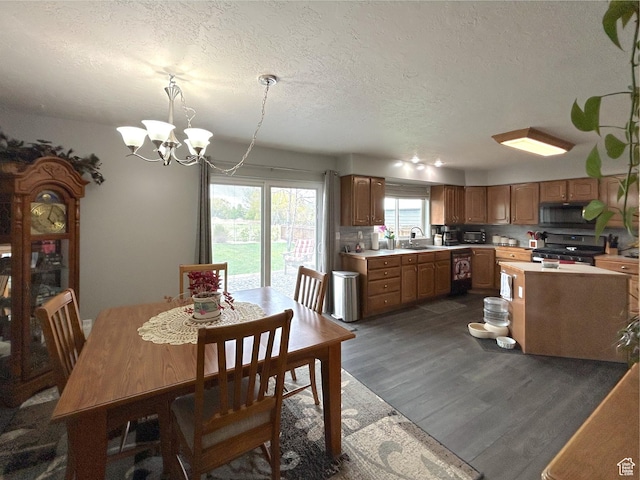 434 S 2nd E, Soda Springs, ID 83276 - dining space featuring a textured ceiling, dark wood-style flooring, and a chandelier