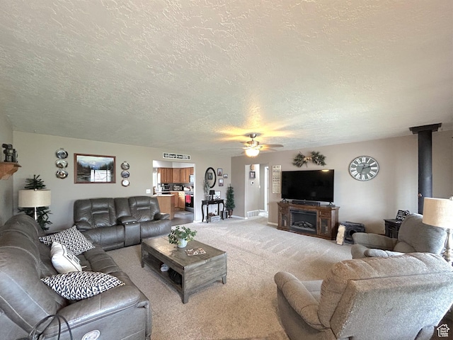 434 S 2nd E, Soda Springs, ID 83276 - living room with a textured ceiling, a ceiling fan, light colored carpet, and baseboards