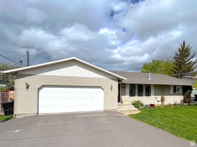 434 S 2nd E, Soda Springs, ID 83276 - view of front of home featuring driveway, a front yard, and an attached garage
