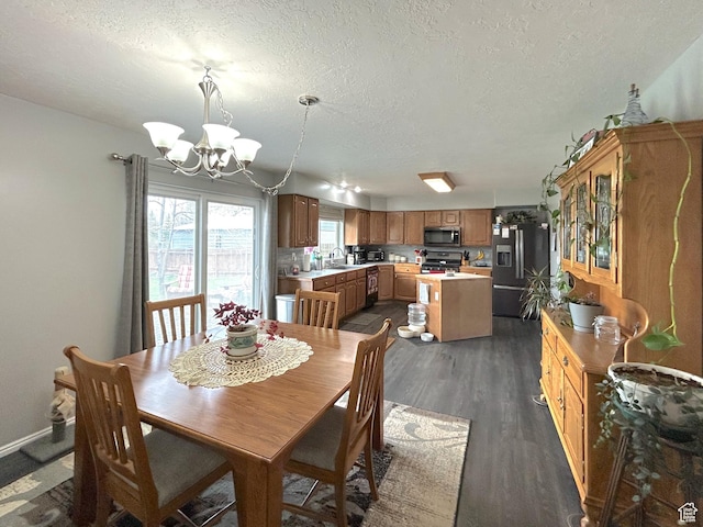 434 S 2nd E, Soda Springs, ID 83276 - dining space featuring a chandelier, dark wood-style flooring, and a textured ceiling