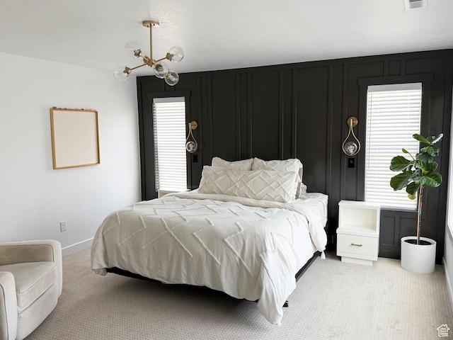 934 W 2740 N, Lehi, UT 84043 - bedroom with light colored carpet, multiple windows, a chandelier, and baseboards