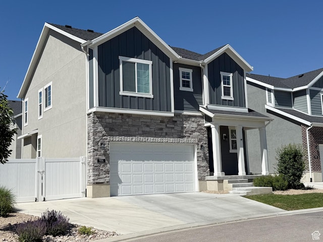 934 W 2740 N, Lehi, UT 84043 - view of front of home with board and batten siding, stone siding, an attached garage, and concrete driveway