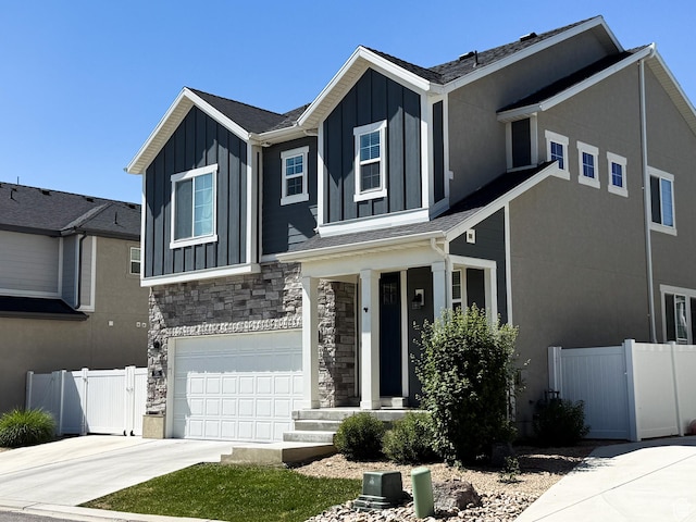 934 W 2740 N, Lehi, UT 84043 - view of front facade with board and batten siding, a garage, stone siding, and concrete driveway