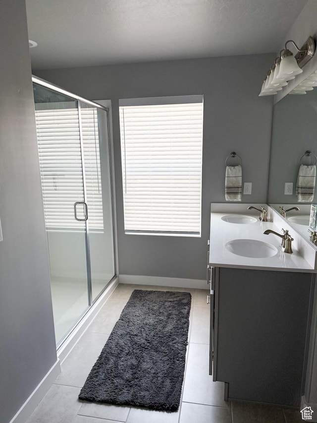 934 W 2740 N, Lehi, UT 84043 - bathroom with a shower stall, double vanity, tile patterned flooring, and baseboards