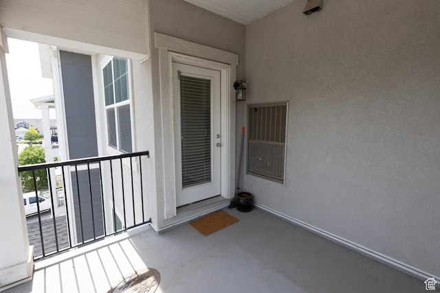 66 W Silver Springs Dr, Vineyard, UT 84059 - doorway to property featuring a balcony and stucco siding