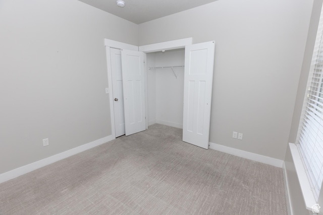 66 W Silver Springs Dr, Vineyard, UT 84059 - unfurnished bedroom with light carpet, a closet, and baseboards