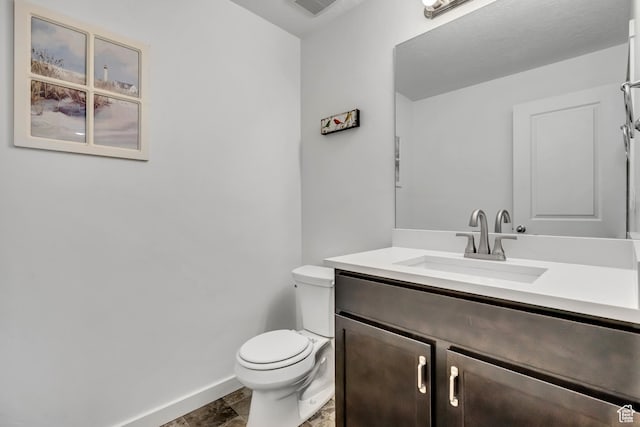 4988 W Mellow Way S, Jordan, UT 84009 - bathroom featuring baseboards, vanity, and toilet