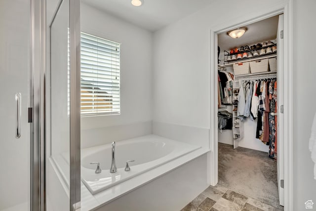 4988 W Mellow Way S, Jordan, UT 84009 - bathroom featuring a bath and a spacious closet