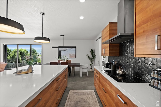 507 W Windmill Gate Cv, Draper, UT 84020 - kitchen featuring wall chimney range hood, black electric stovetop, brown cabinetry, tasteful backsplash, and recessed lighting