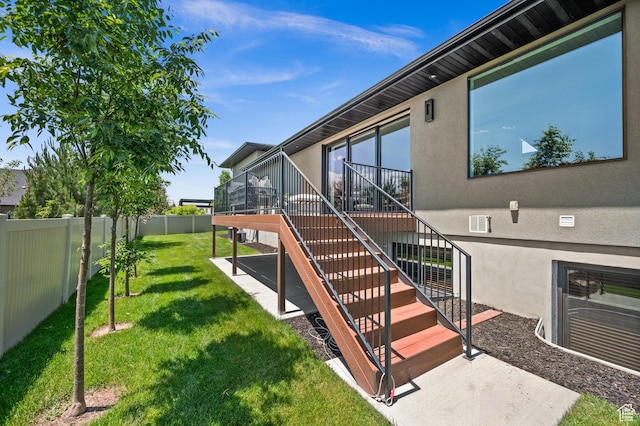 507 W Windmill Gate Cv, Draper, UT 84020 - view of exterior entry with stucco siding, a wooden deck, and a patio