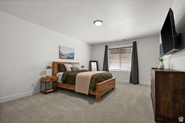 507 W Windmill Gate Cv, Draper, UT 84020 - bedroom with light colored carpet, baseboards, and a textured ceiling