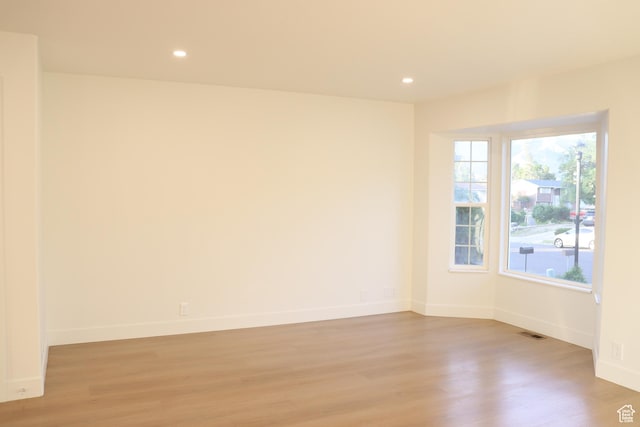 579 N 430 E Unit 2, Tooele, UT 84074 - spare room with light wood-style floors, baseboards, and recessed lighting