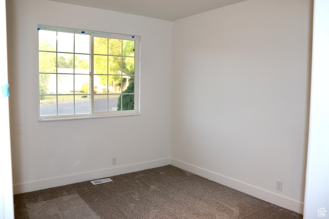 579 N 430 E Unit 2, Tooele, UT 84074 - spare room featuring baseboards and dark carpet