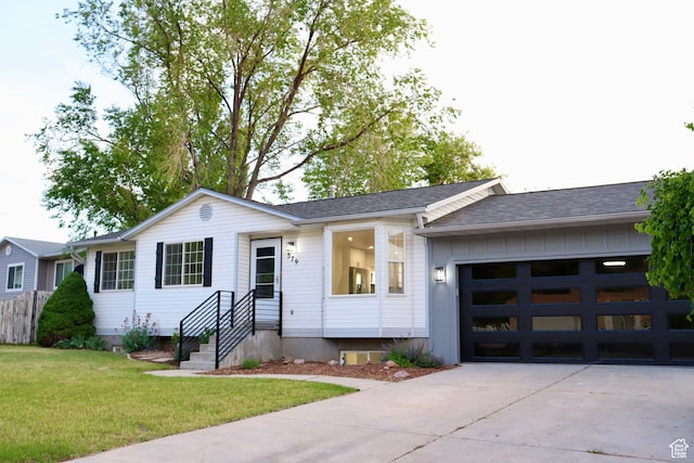 579 N 430 E Unit 2, Tooele, UT 84074 - single story home with driveway, a garage, a front lawn, and a shingled roof