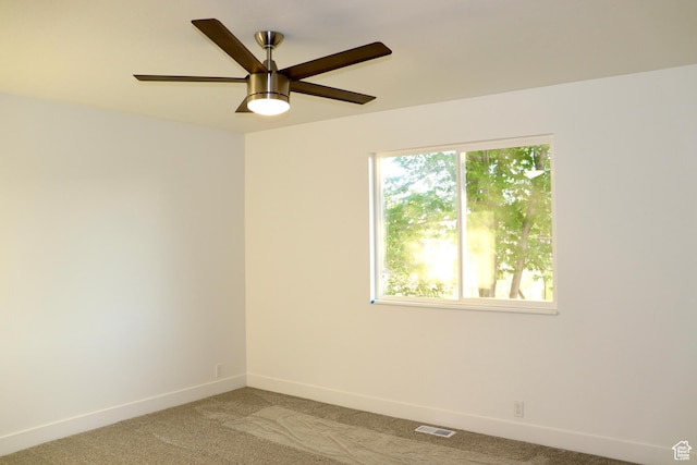 579 N 430 E Unit 2, Tooele, UT 84074 - empty room featuring light carpet, baseboards, and a ceiling fan