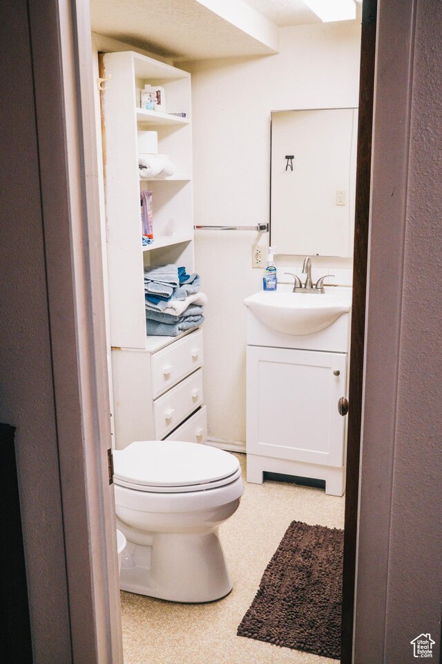 201 Bannock St, Malad City, ID 83252 - half bathroom with vanity and toilet