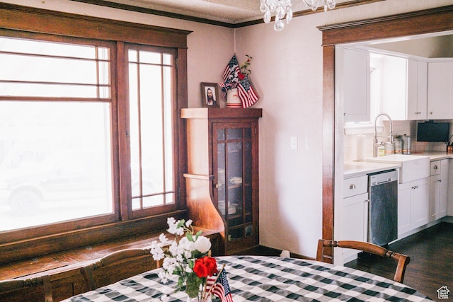 201 Bannock St, Malad City, ID 83252 - dining room featuring a chandelier, crown molding, and dark wood-type flooring