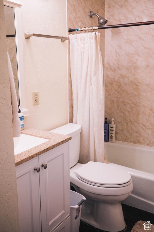 201 Bannock St, Malad City, ID 83252 - full bath with vanity, toilet, shower / bath combo with shower curtain, and a textured wall