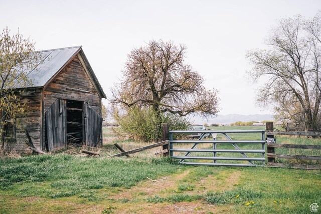 201 Bannock St, Malad City, ID 83252 - view of outdoor structure with a gate and a mountain view