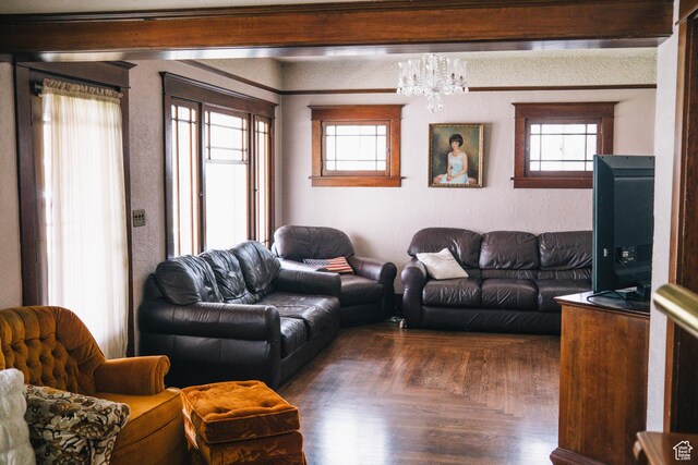 201 Bannock St, Malad City, ID 83252 - living room with healthy amount of natural light, wood finished floors, and a chandelier