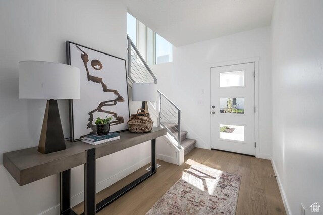 264 E Cedar Ln Unit 208, Midvale, UT 84070 - foyer featuring stairs and wood finished floors