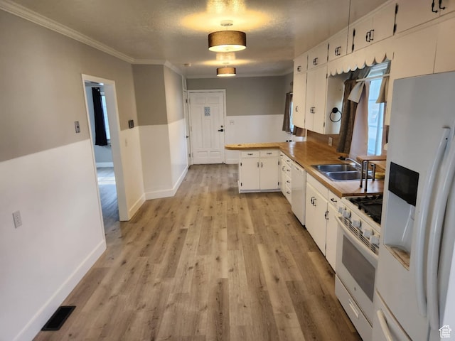 713 E 2nd St, Ogden, UT 84404 - kitchen with white appliances, a sink, white cabinetry, a peninsula, and light wood finished floors