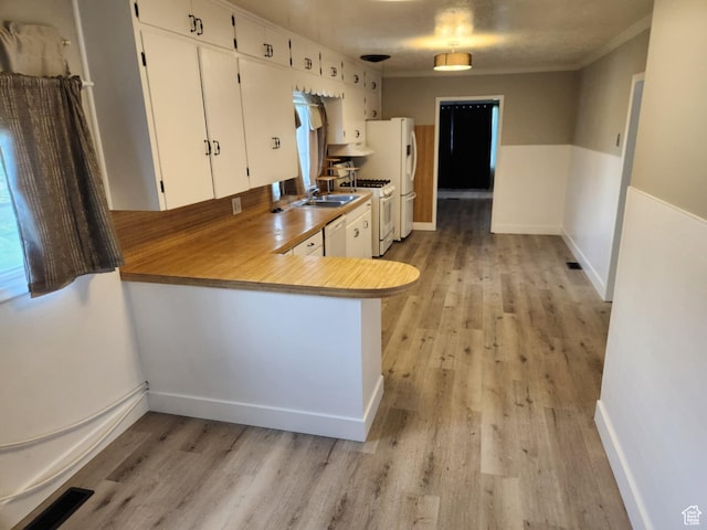 713 E 2nd St, Ogden, UT 84404 - kitchen with white appliances, light wood-type flooring, white cabinets, and ornamental molding