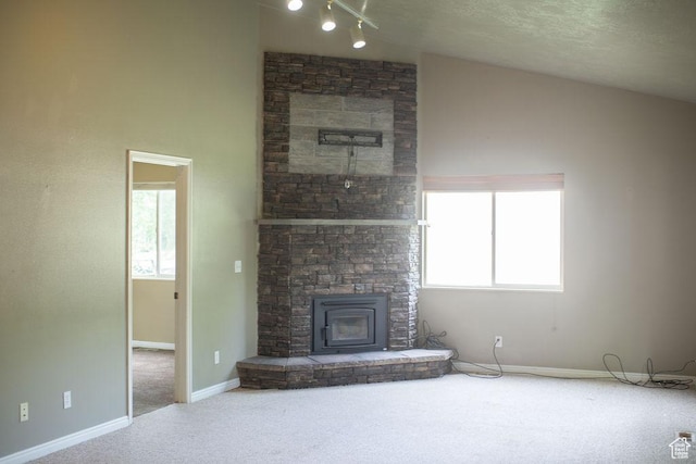 1271 S Main St S, Mapleton, UT 84664 - unfurnished living room featuring carpet floors, baseboards, track lighting, and a fireplace