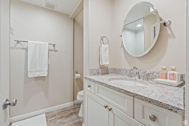 819 E 12085 S, Draper, UT 84020 - full bath featuring vanity, toilet, wood finish floors, a shower, and baseboards
