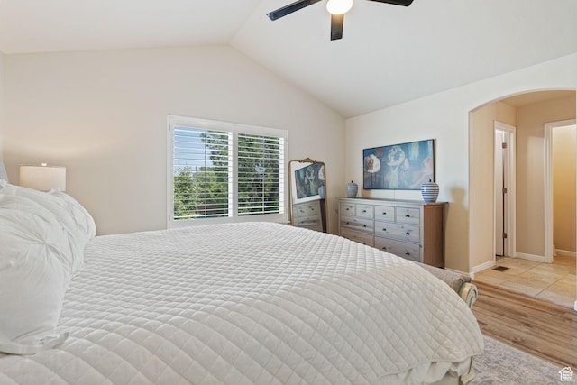 819 E 12085 S, Draper, UT 84020 - bedroom featuring vaulted ceiling, arched walkways, a ceiling fan, and wood finished floors