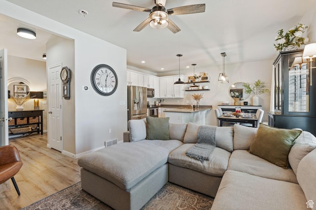 819 E 12085 S, Draper, UT 84020 - living area with a ceiling fan, light wood finished floors, recessed lighting, and baseboards