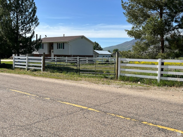 8842 E 500 S, Huntsville, UT 84317 - view of front of home featuring a fenced front yard and a mountain view