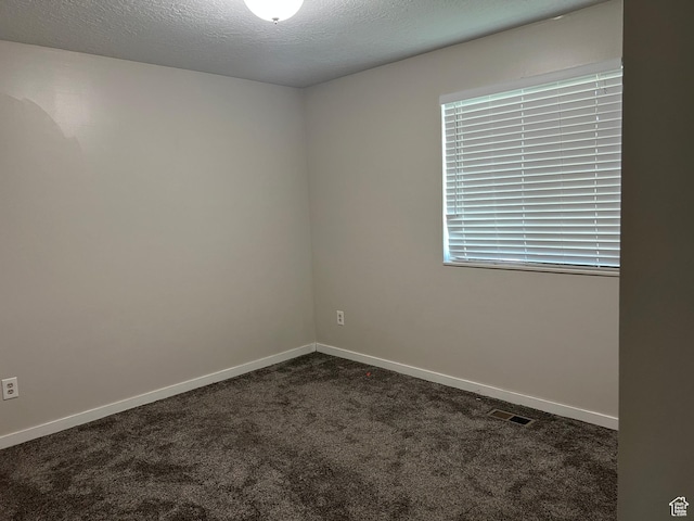 8842 E 500 S, Huntsville, UT 84317 - unfurnished room featuring dark carpet, baseboards, and a textured ceiling