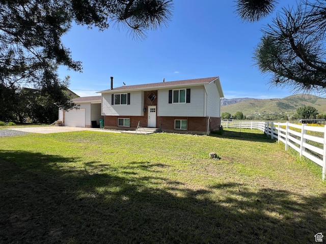 8842 E 500 S, Huntsville, UT 84317 - raised ranch with a garage, driveway, a mountain view, and brick siding