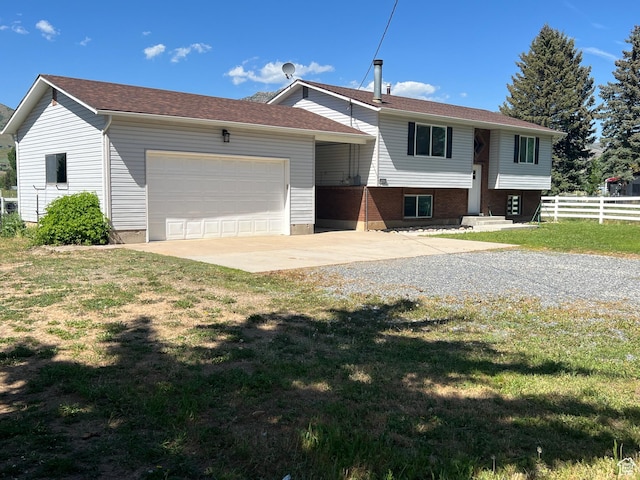 8842 E 500 S, Huntsville, UT 84317 - raised ranch featuring driveway and an attached garage