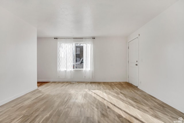 3185 S 4060 W, Salt Lake City, UT 84120 - unfurnished room featuring baseboards and wood finished floors
