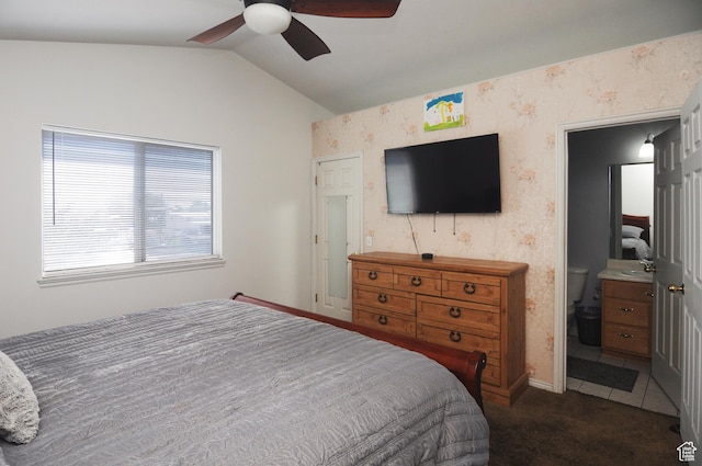 1877 W 2175 S, Syracuse, UT 84075 - bedroom featuring vaulted ceiling, dark carpet, wallpapered walls, a ceiling fan, and connected bathroom