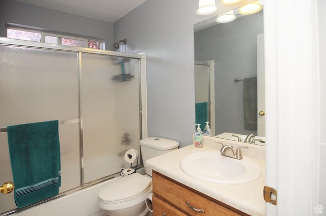 1877 W 2175 S, Syracuse, UT 84075 - bathroom featuring vanity, toilet, and bath / shower combo with glass door