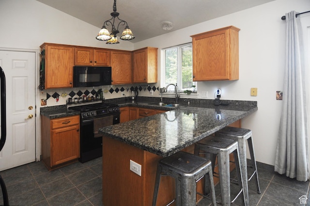 1877 W 2175 S, Syracuse, UT 84075 - kitchen featuring gas range, black microwave, a sink, a peninsula, and dark tile patterned flooring