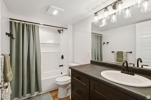 693 W Fireside Ln, Stansbury Park, UT 84074 - bathroom with toilet, vanity, shower / bath combo with shower curtain, and wood finished floors