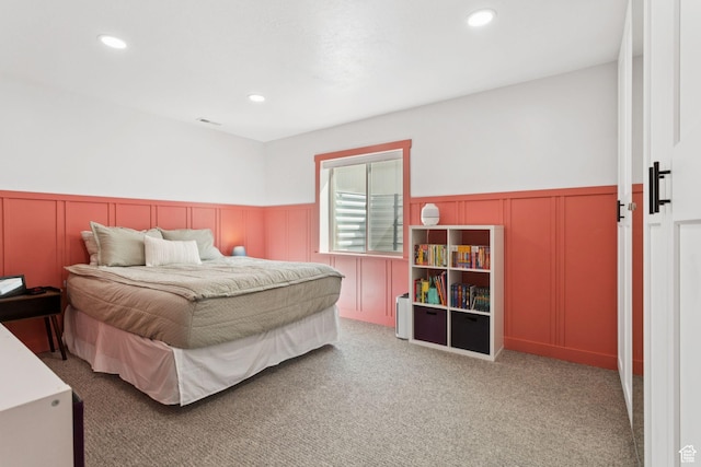 693 W Fireside Ln, Stansbury Park, UT 84074 - bedroom featuring a decorative wall, wainscoting, recessed lighting, and carpet