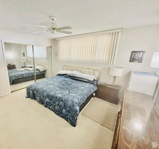 381 W 400 N Unit 12, Bountiful, UT 84010 - carpeted bedroom featuring a textured ceiling, a closet, and ceiling fan