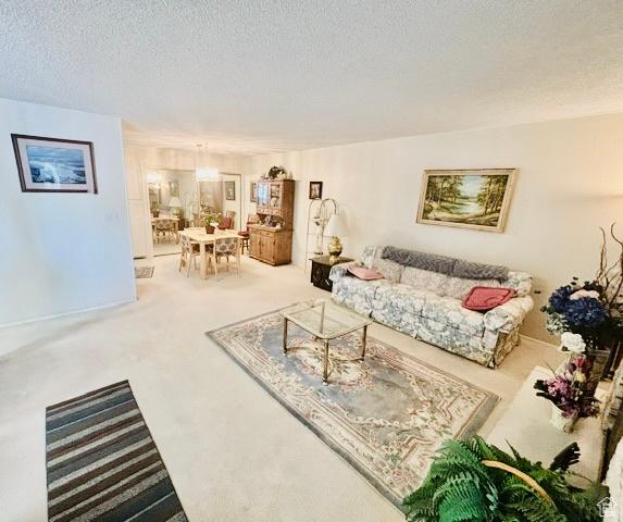 381 W 400 N Unit 12, Bountiful, UT 84010 - living area featuring a textured ceiling and carpet flooring