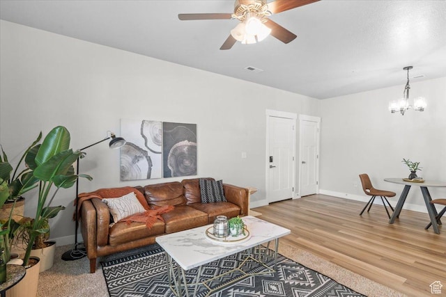 4192 W Mckellen Dr Unit B2, Herriman, UT 84096 - living area with ceiling fan, a chandelier, wood finished floors, and baseboards